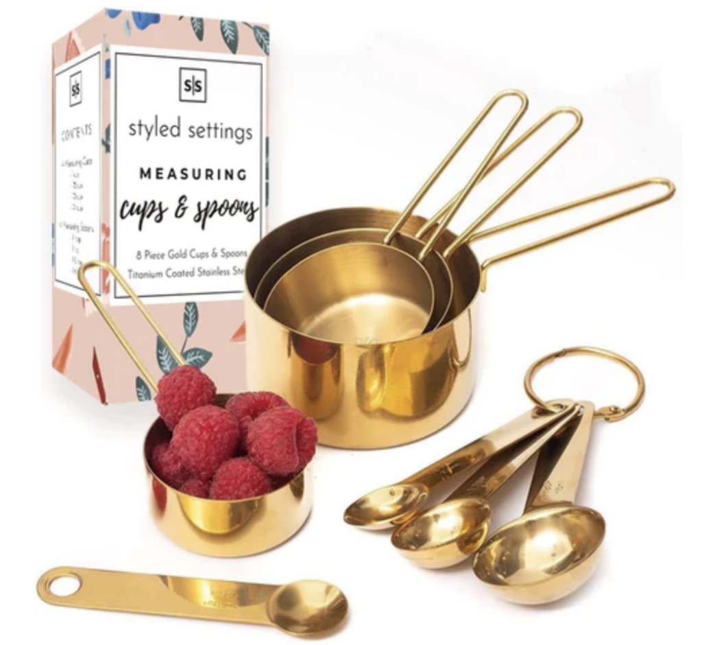 gold measuring spoons and cups