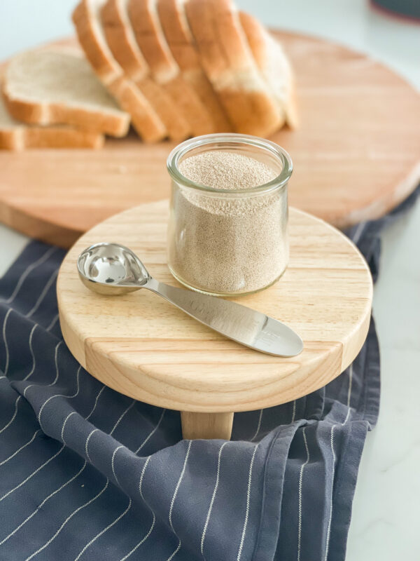 yeast spoon with jar of yeast